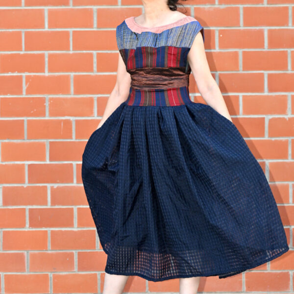 Statement dress with a full skirt and bold fabric combination, custom tailored