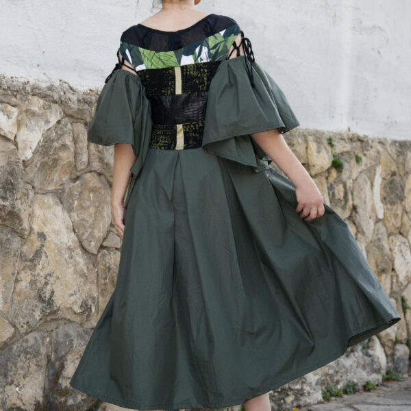 Unique olive green women's dress with black waist detail, leaf print and wide sleeves